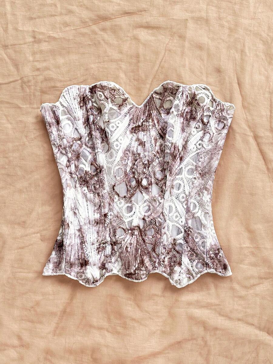 Strapless floral corset top with lace-up detail, asymmetrical hem, and slim fit for women in a boho vacation style.
