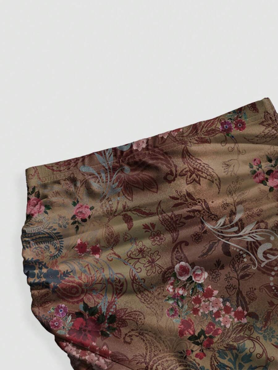 Black low waist ruched bodycon maxi skirt with sun and moon full print pattern on high stretch knitted fabric.