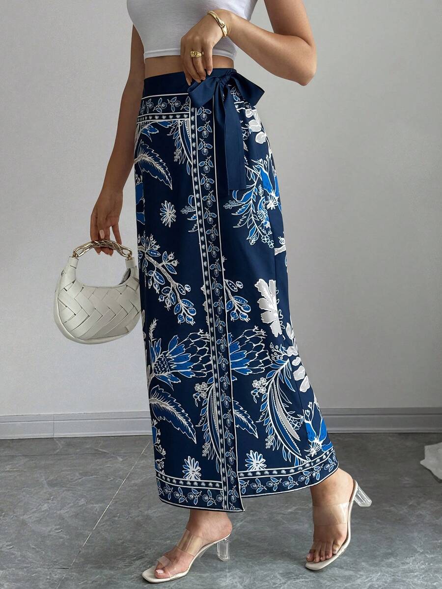 women's multicolor floral print wrap skirt featuring a high-waisted tie belt, A-line long silhouette, and boho woven fabric.