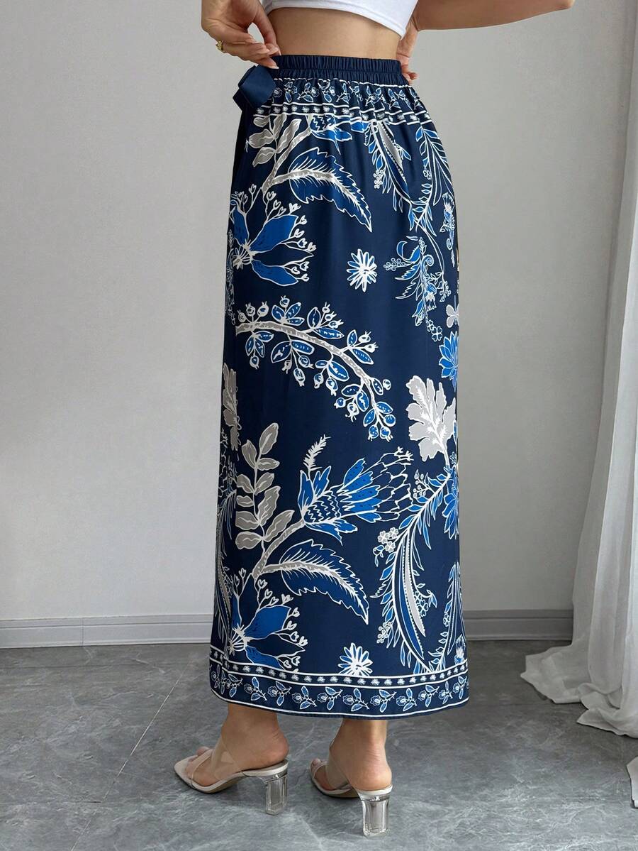 women's multicolor floral print wrap skirt featuring a high-waisted tie belt, A-line long silhouette, and boho woven fabric.