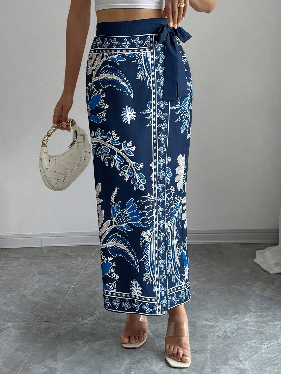 women's multicolor floral print wrap skirt featuring a high-waisted tie belt, A-line long silhouette, and boho woven fabric.
