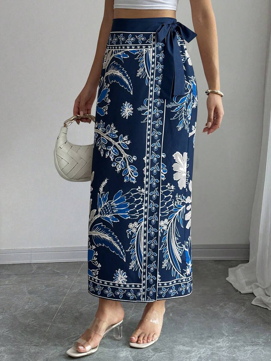 women's multicolor floral print wrap skirt featuring a high-waisted tie belt, A-line long silhouette, and boho woven fabric.