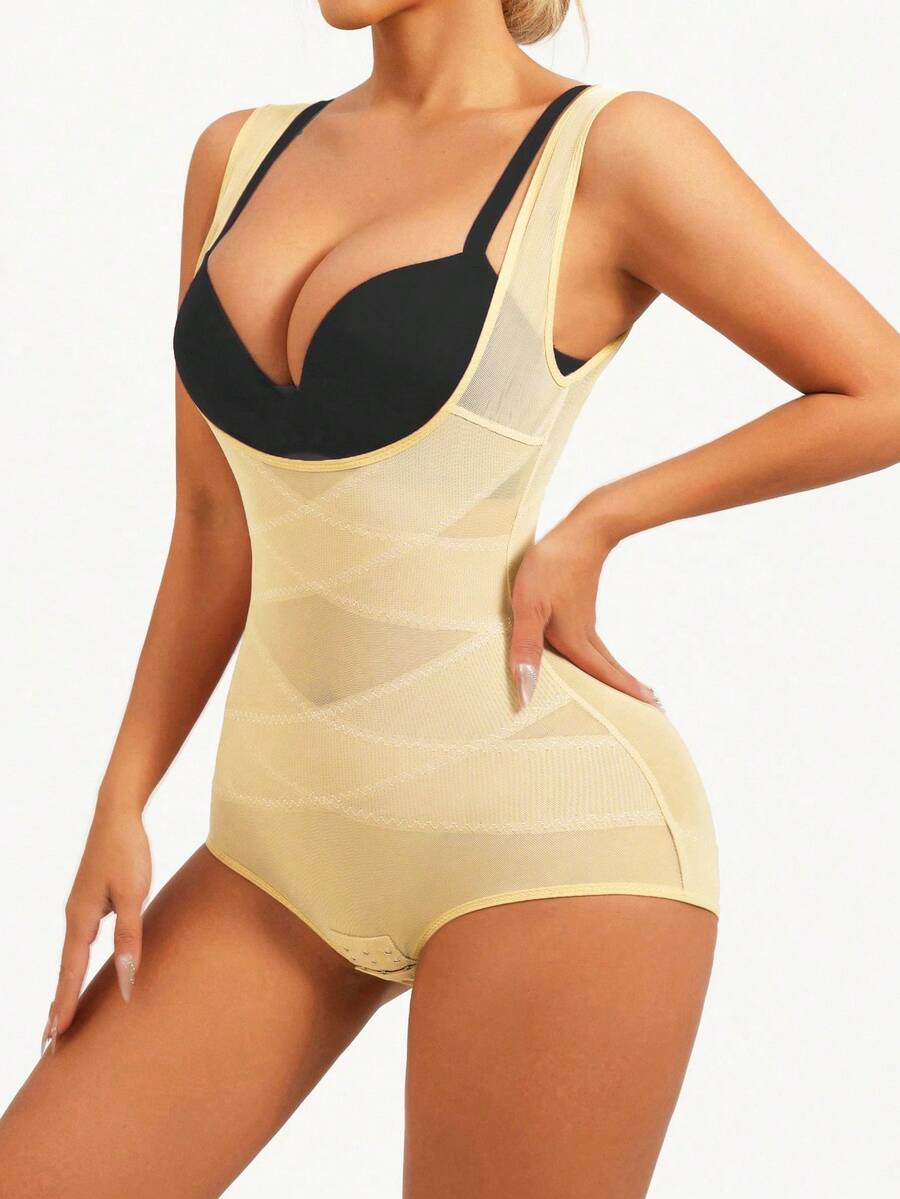 Apricot semi-sheer mesh shapewear bodysuit for women featuring a low-cut neckline, bust support, contrast mesh details, and Bermuda shorts length.