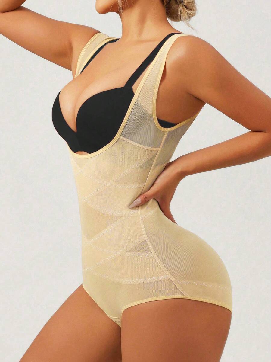 Apricot semi-sheer mesh shapewear bodysuit for women featuring a low-cut neckline, bust support, contrast mesh details, and Bermuda shorts length.