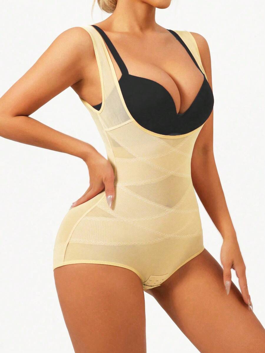 Apricot semi-sheer mesh shapewear bodysuit for women featuring a low-cut neckline, bust support, contrast mesh details, and Bermuda shorts length.