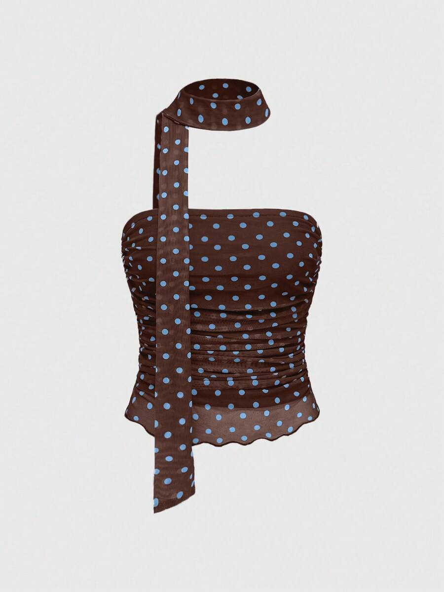 Women's black polka dot strapless tube top made of ruched mesh fabric featuring an asymmetrical hem and matching scarf.
