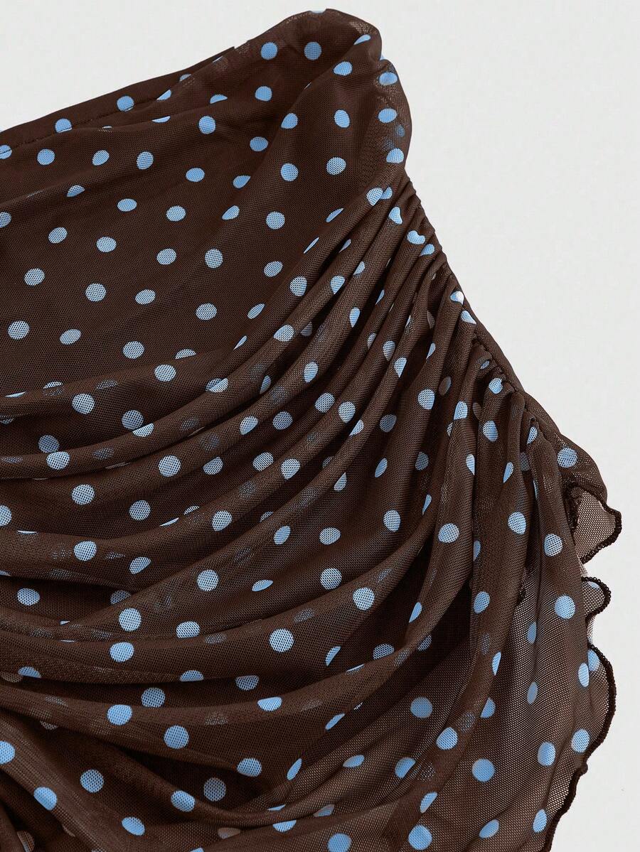 Women's black polka dot strapless tube top made of ruched mesh fabric featuring an asymmetrical hem and matching scarf.