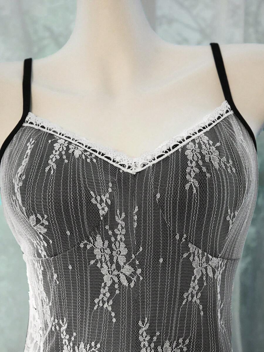 Women's black lace patchwork bodycon midi dress with sleeveless slim fit cut.