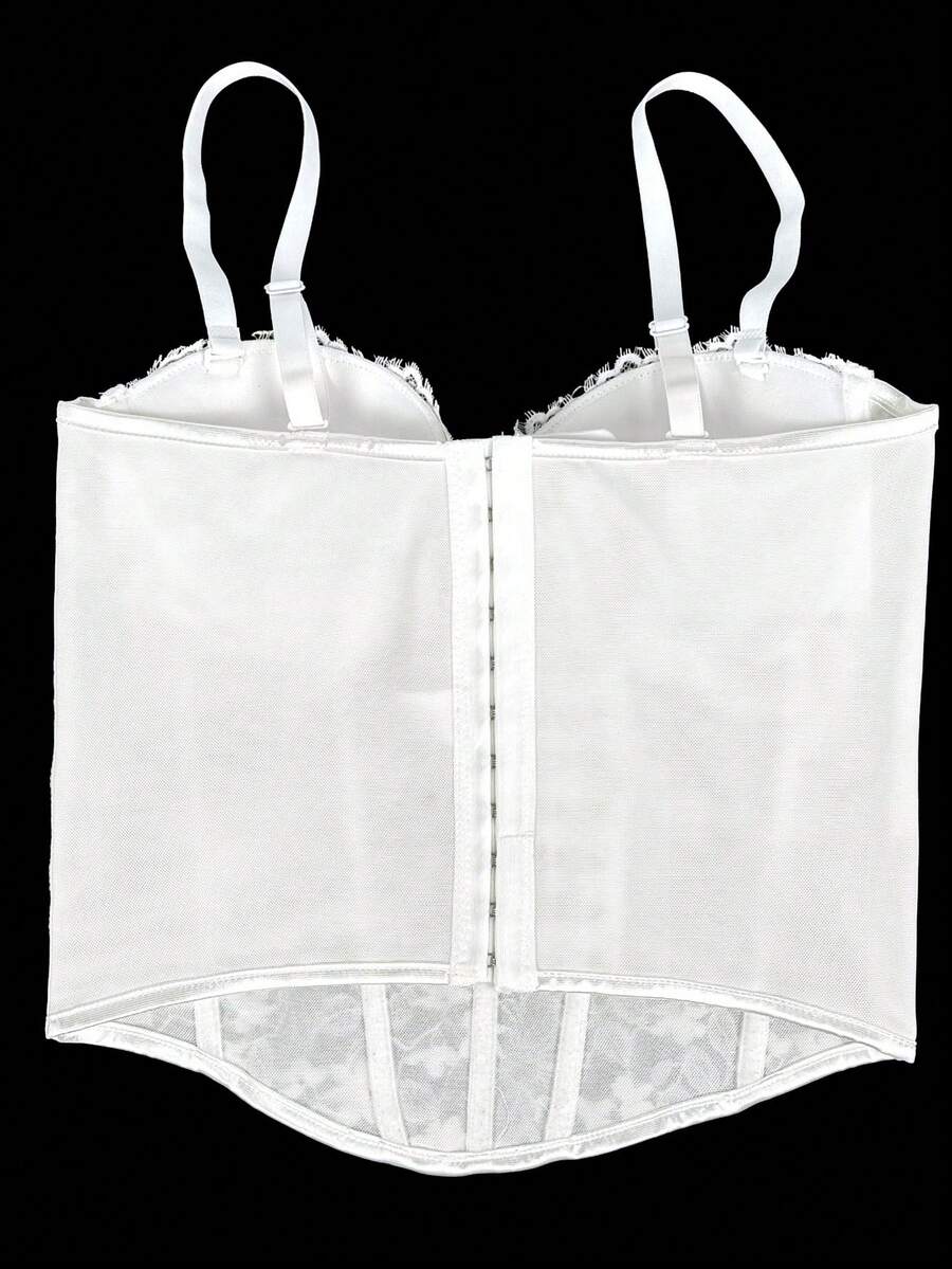 Black women's shaping cami with contrast lace, spaghetti straps, asymmetrical hem, lined body, and slim fit for casual and night-out styling.