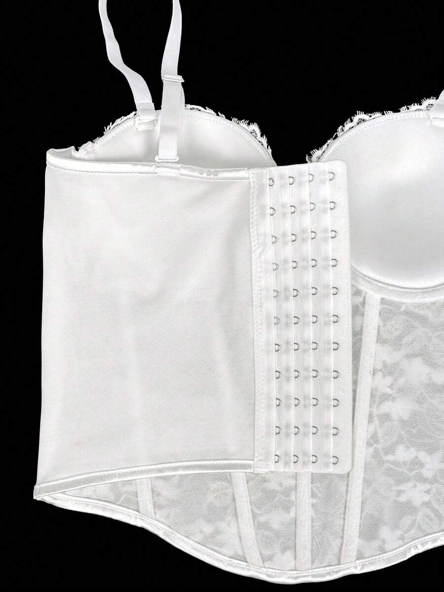 Black women's shaping cami with contrast lace, spaghetti straps, asymmetrical hem, lined body, and slim fit for casual and night-out styling.