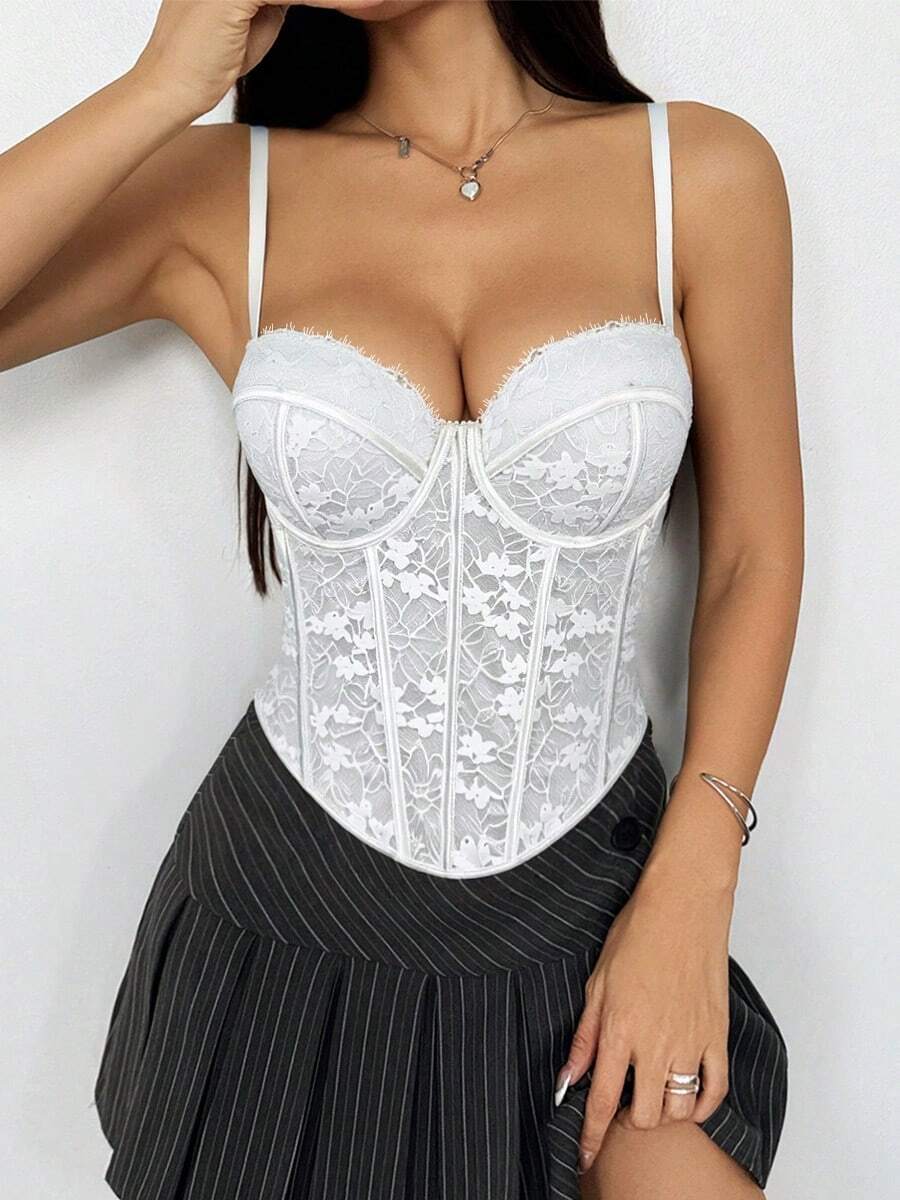Black women's shaping cami with contrast lace, spaghetti straps, asymmetrical hem, lined body, and slim fit for casual and night-out styling.