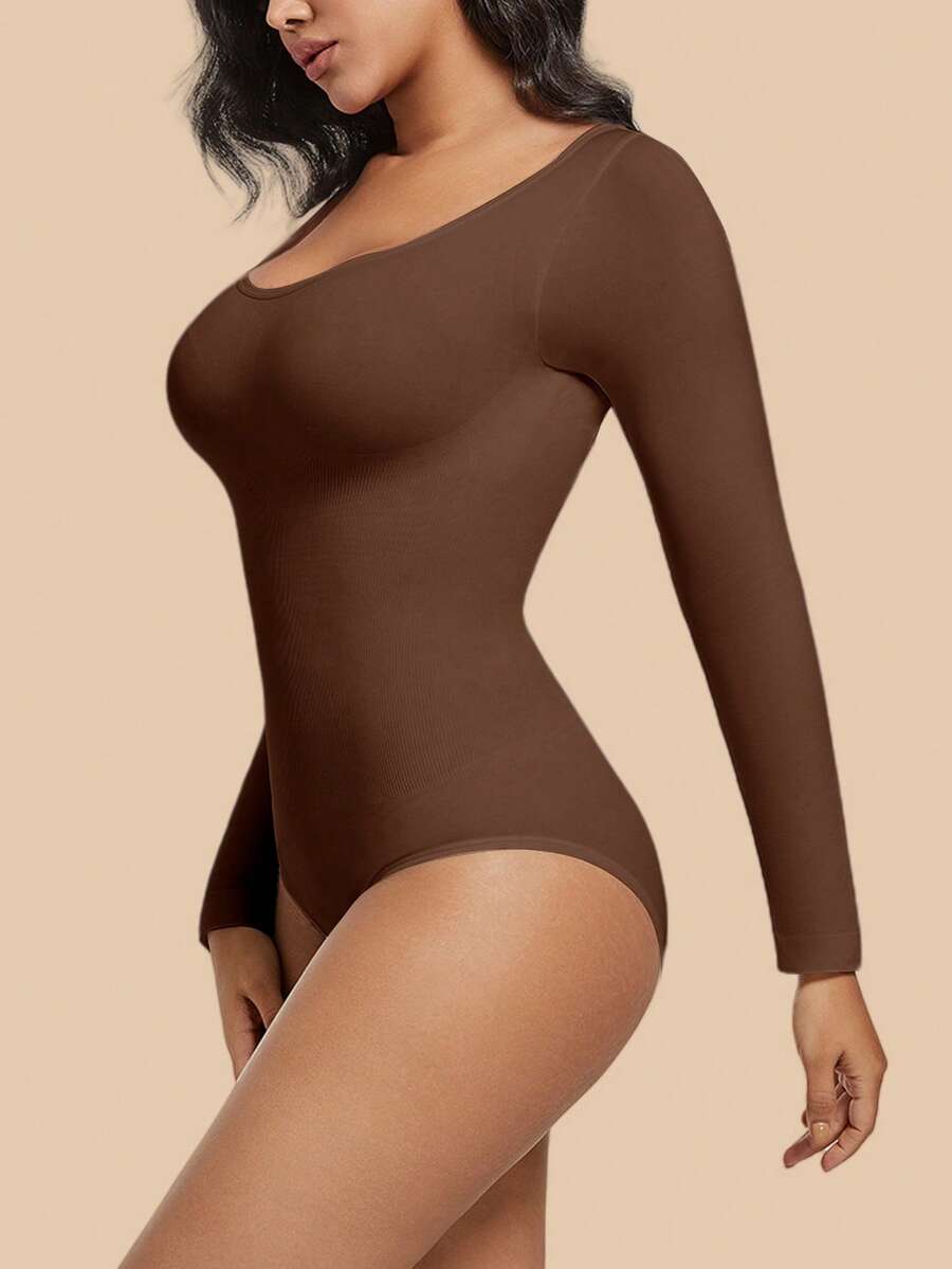 Women's black seamless bodysuit shapewear with tummy control and butt lift design.