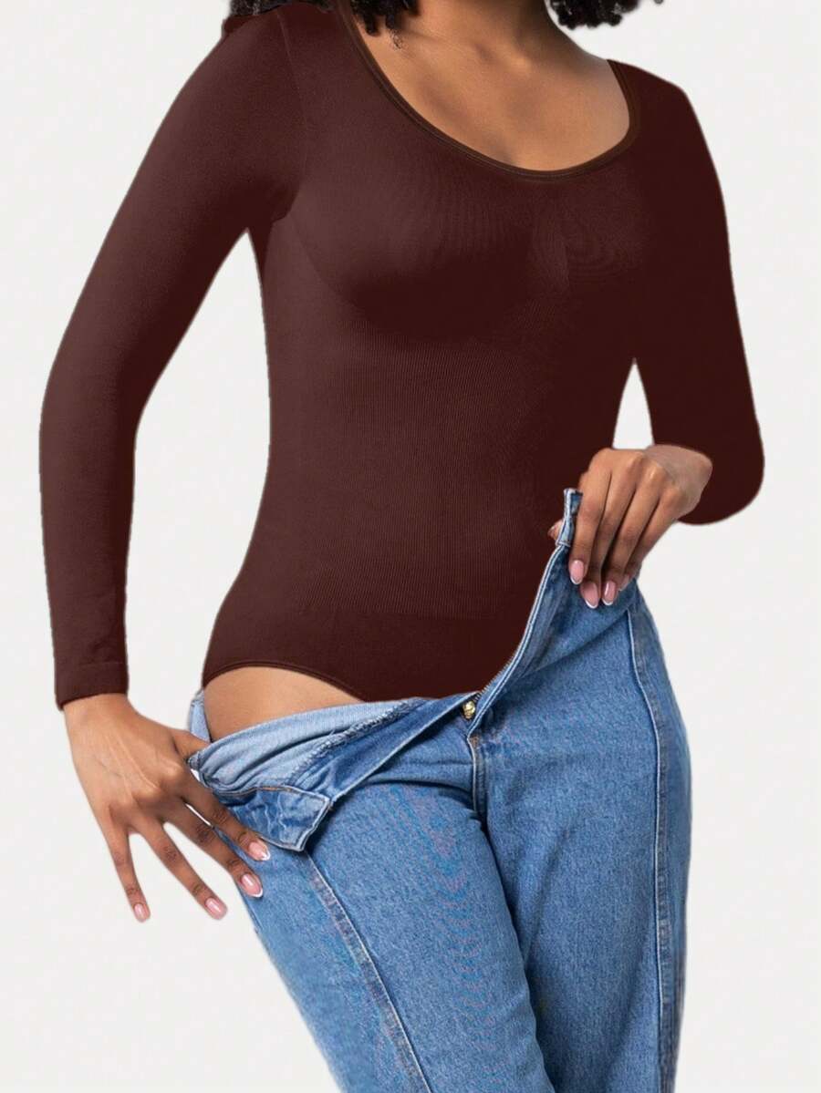 Black seamless long sleeve crew neck shapewear bodysuit for women featuring full coverage tummy control.