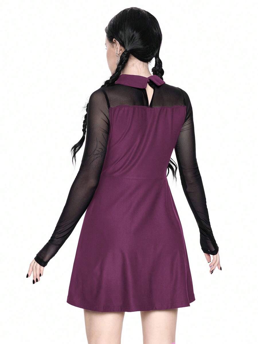Women wearing a black gothic Halloween cat graphic print mini dress with a collar, extra-long sleeves, and a high waist fit and flare silhouette.