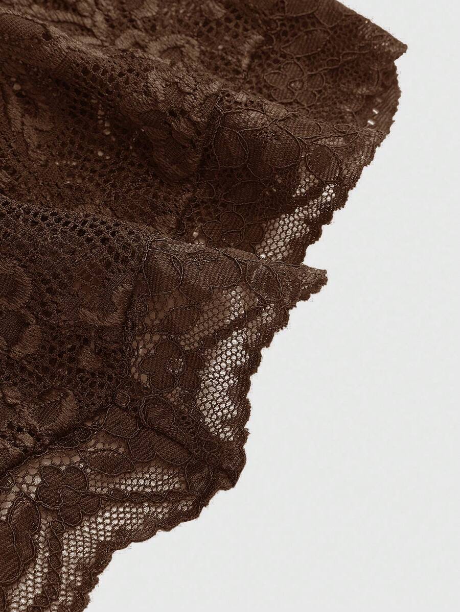 Women's black lace halter neck camisole featuring a backless crop silhouette, contrast lace trim, and scallop hem.