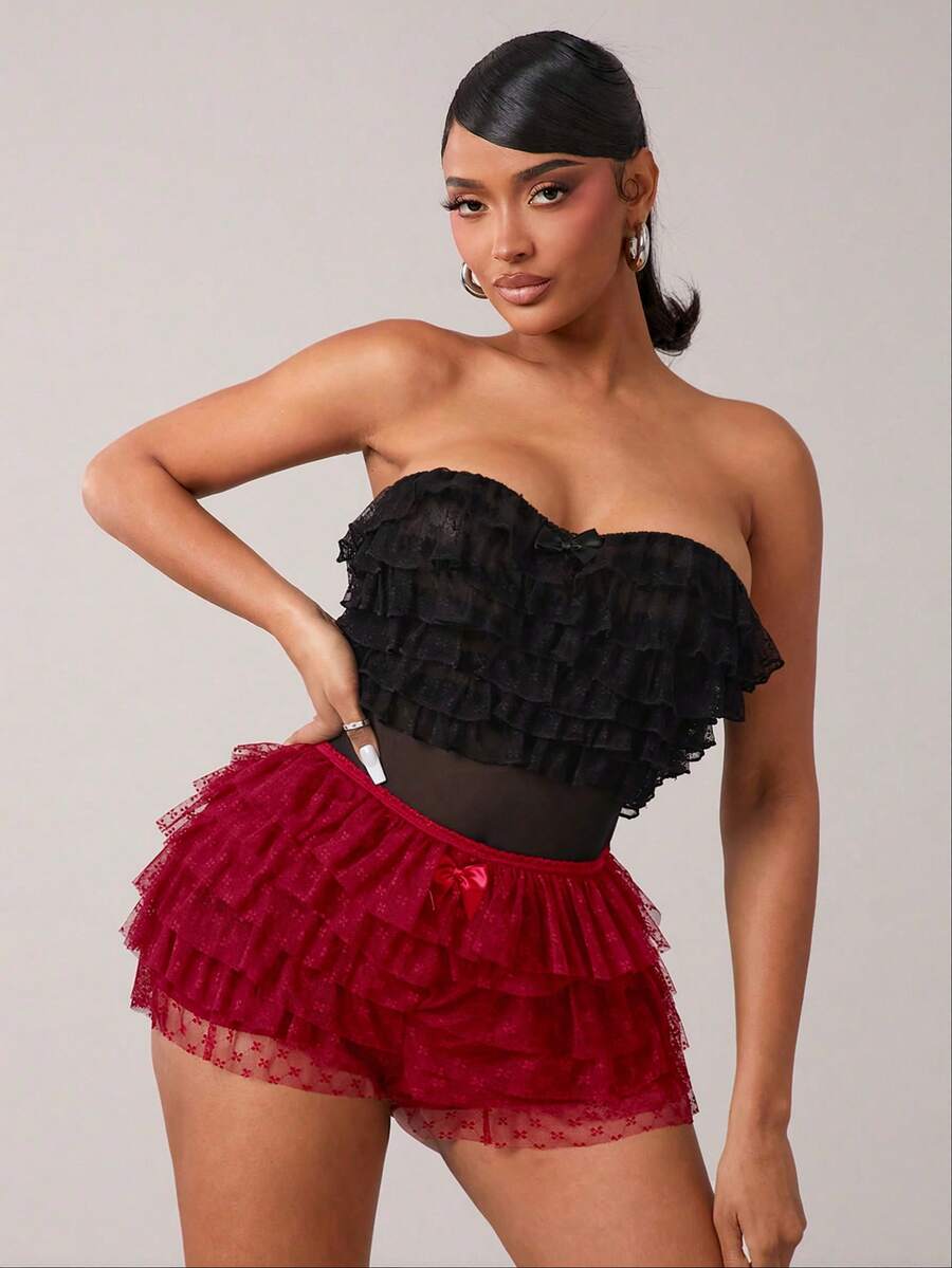 Apricot tiered lace ruffle hem low waist shorts for women featuring elastic waist and lined semi-sheer knit fabric.