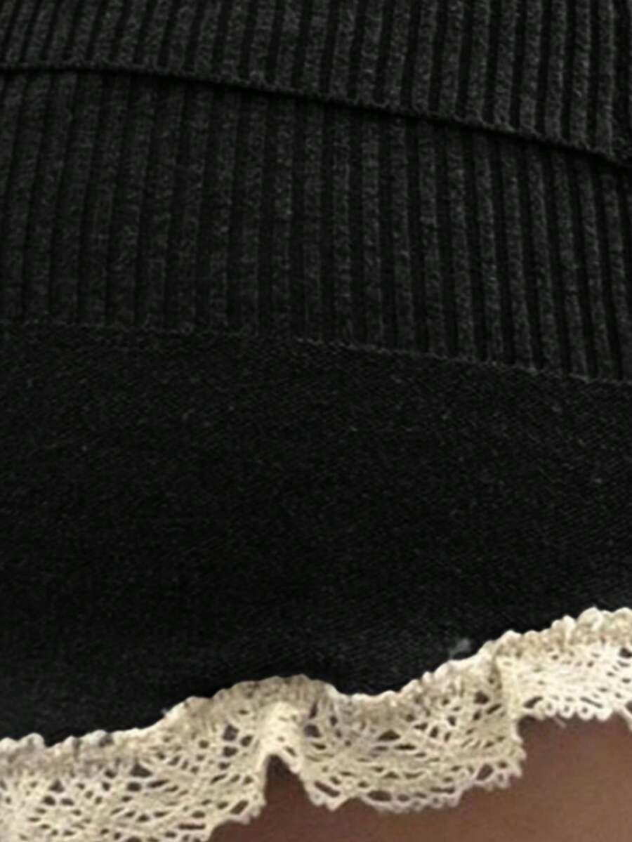 Women's high waist knitted short skirt in black featuring contrast lace-up detail with metal grommets.