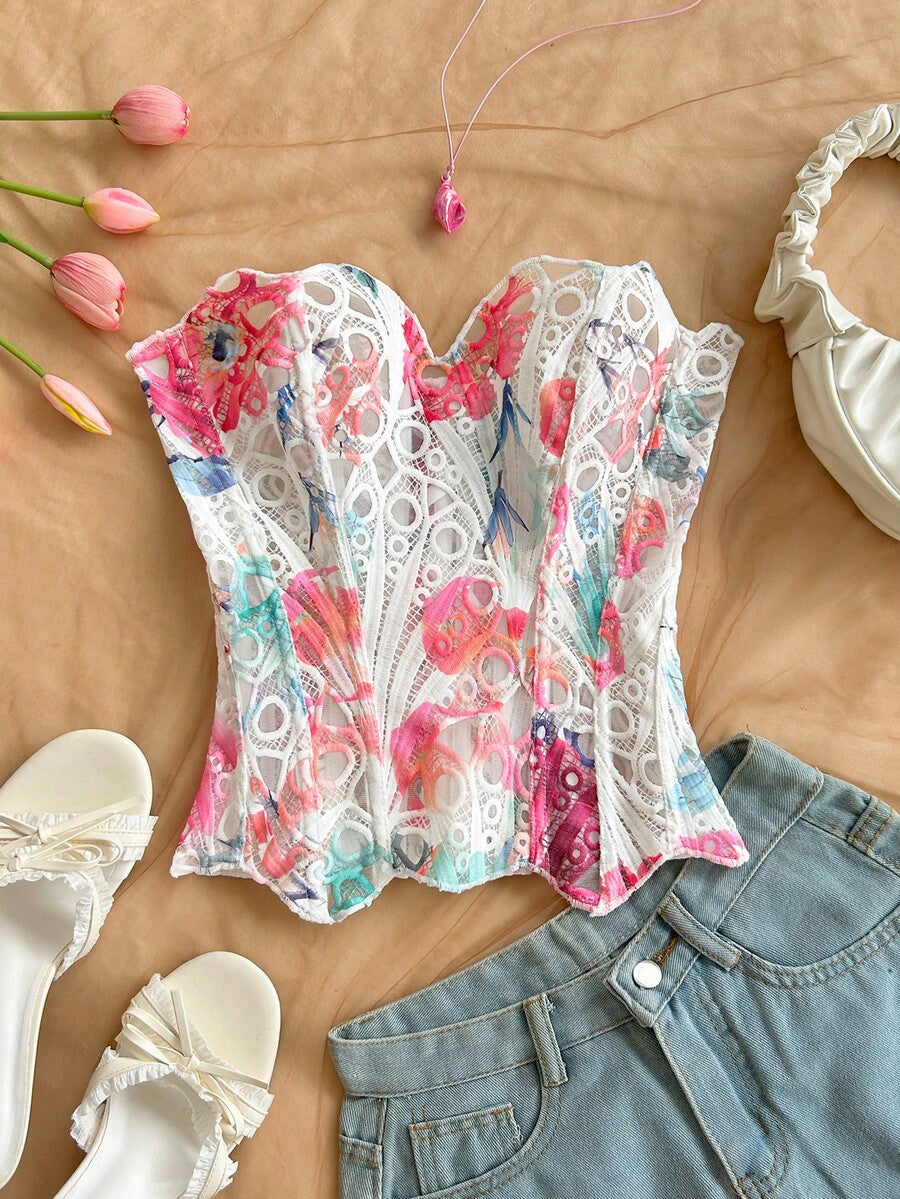 Strapless floral corset top with lace-up detail, asymmetrical hem, and slim fit for women in a boho vacation style.