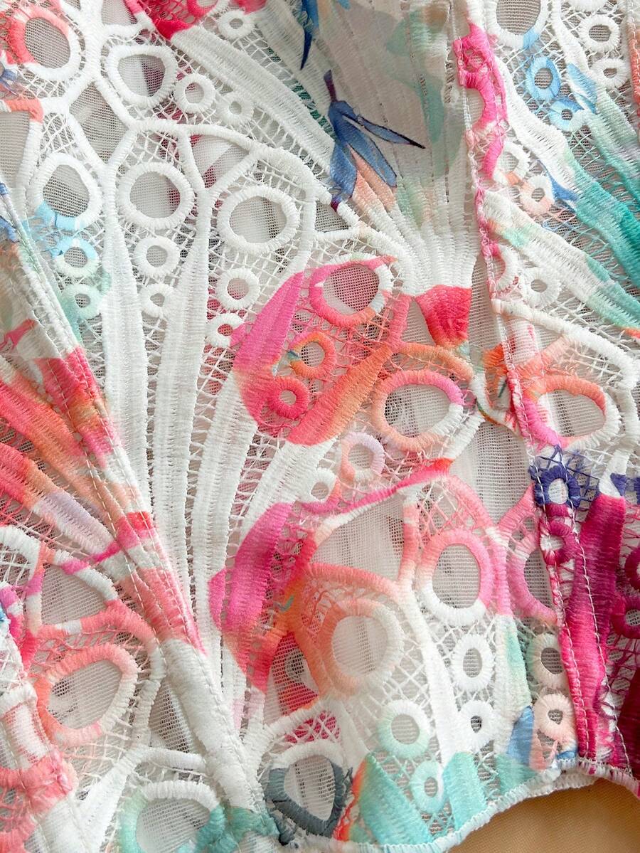 Strapless floral corset top with lace-up detail, asymmetrical hem, and slim fit for women in a boho vacation style.