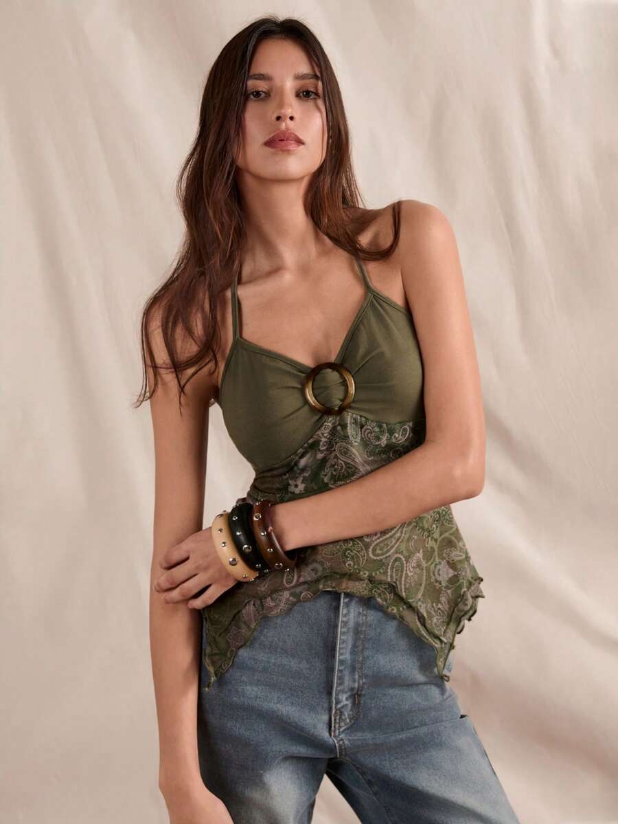 Women's backless halter cami top featuring a paisley print, sleeveless design, and an asymmetrical hem in knitted fabric.