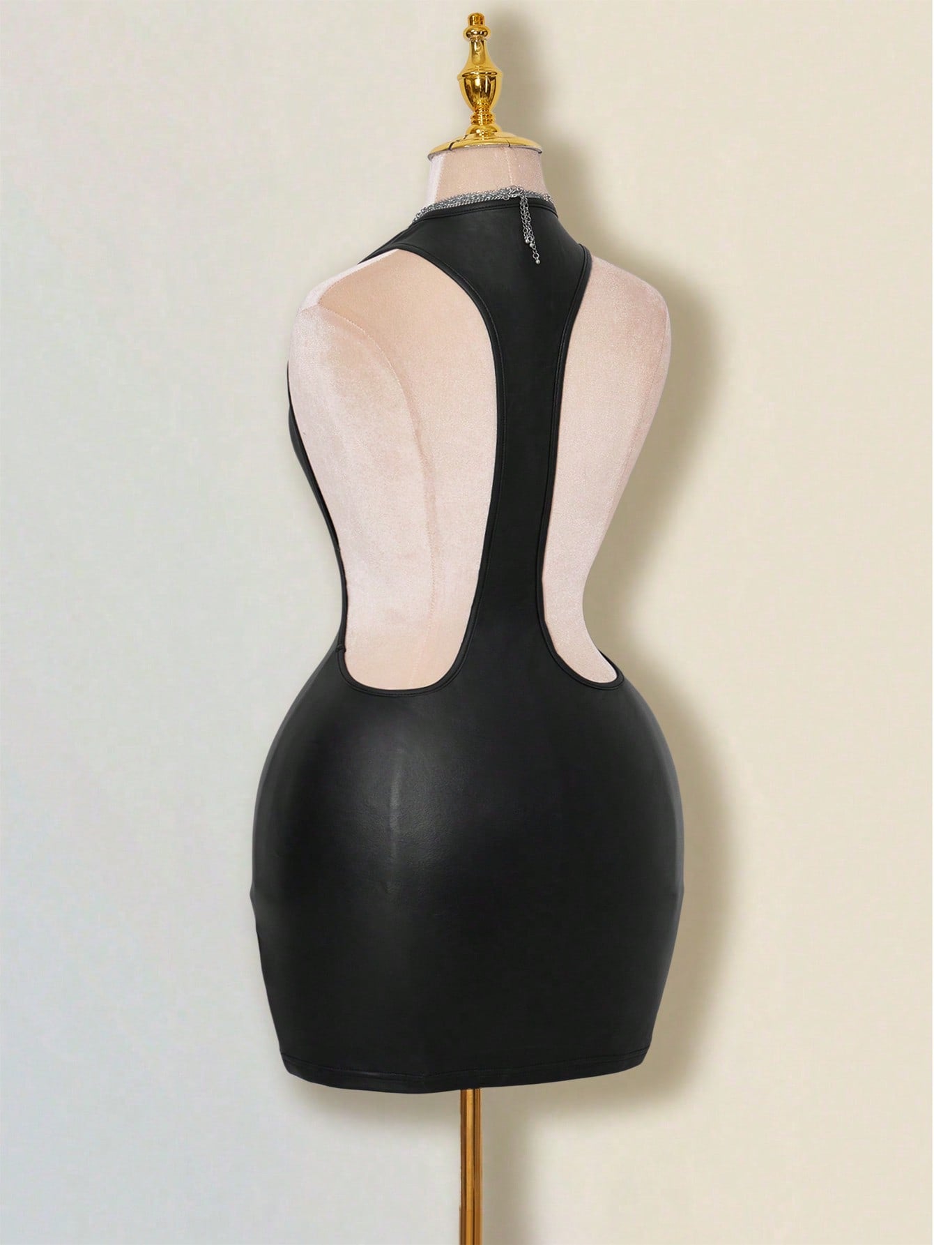 Apricot criss-cross backless bodycon mini dress for women featuring a round neck and rhinestone accent details.