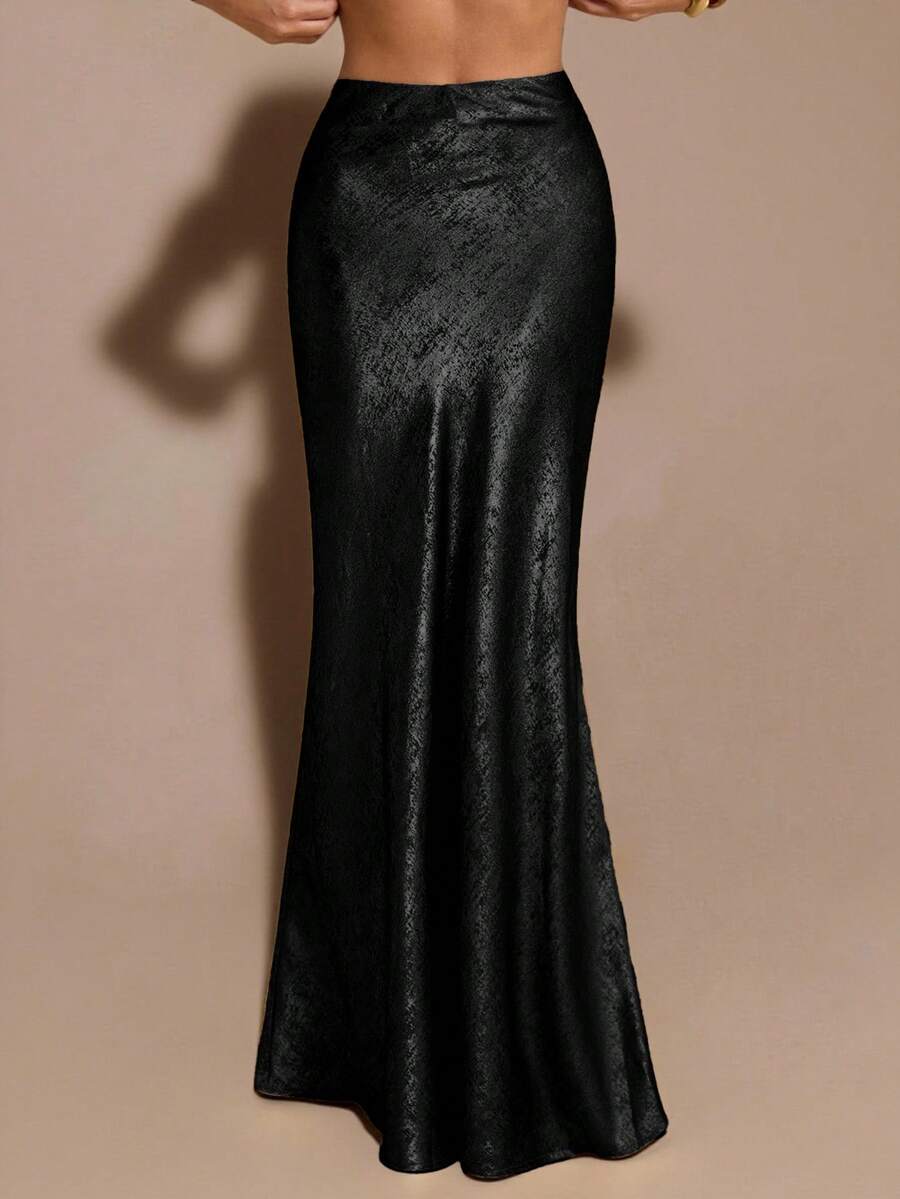 Black low waist extra long mermaid maxi skirt with asymmetrical zipper detail and side slit.