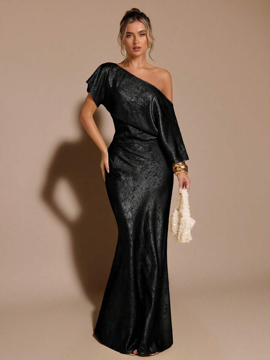 Black low waist extra long mermaid maxi skirt with asymmetrical zipper detail and side slit.
