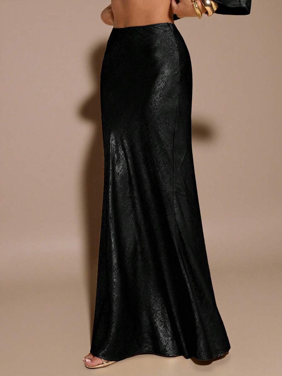 Black low waist extra long mermaid maxi skirt with asymmetrical zipper detail and side slit.