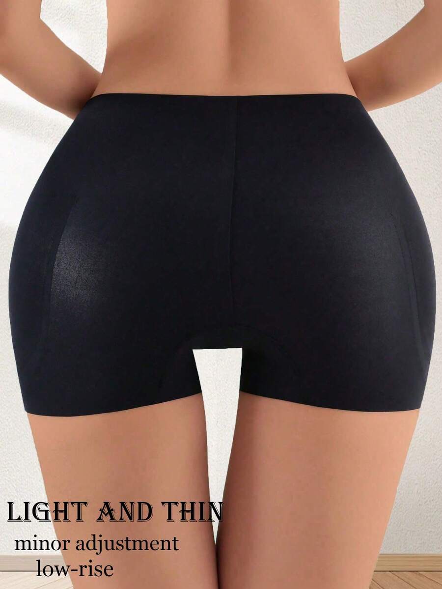 Women's high waist seamless tummy control panties with hip enhancer padding in apricot.