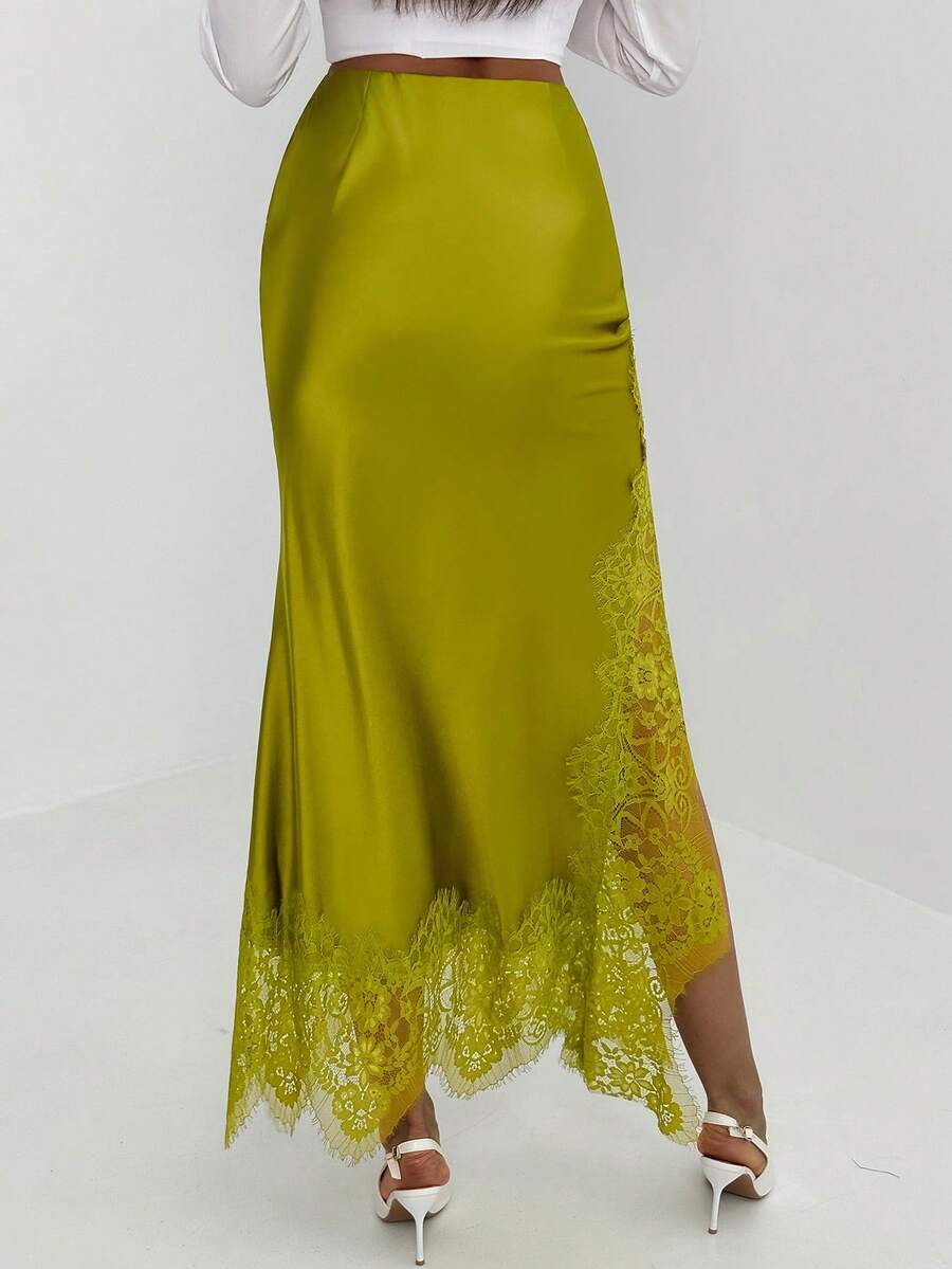 Women's elegant black lace patchwork mermaid maxi skirt featuring asymmetrical contrast lace design and low waist fit.