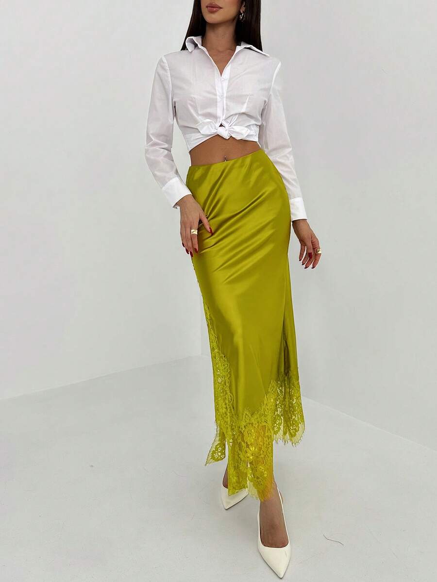 Women's elegant black lace patchwork mermaid maxi skirt featuring asymmetrical contrast lace design and low waist fit.