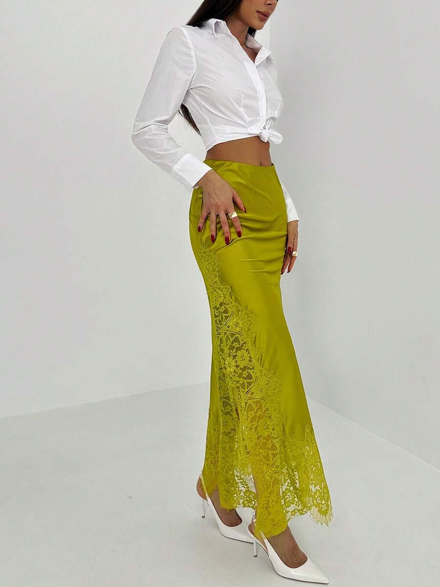 Women's elegant black lace patchwork mermaid maxi skirt featuring asymmetrical contrast lace design and low waist fit.