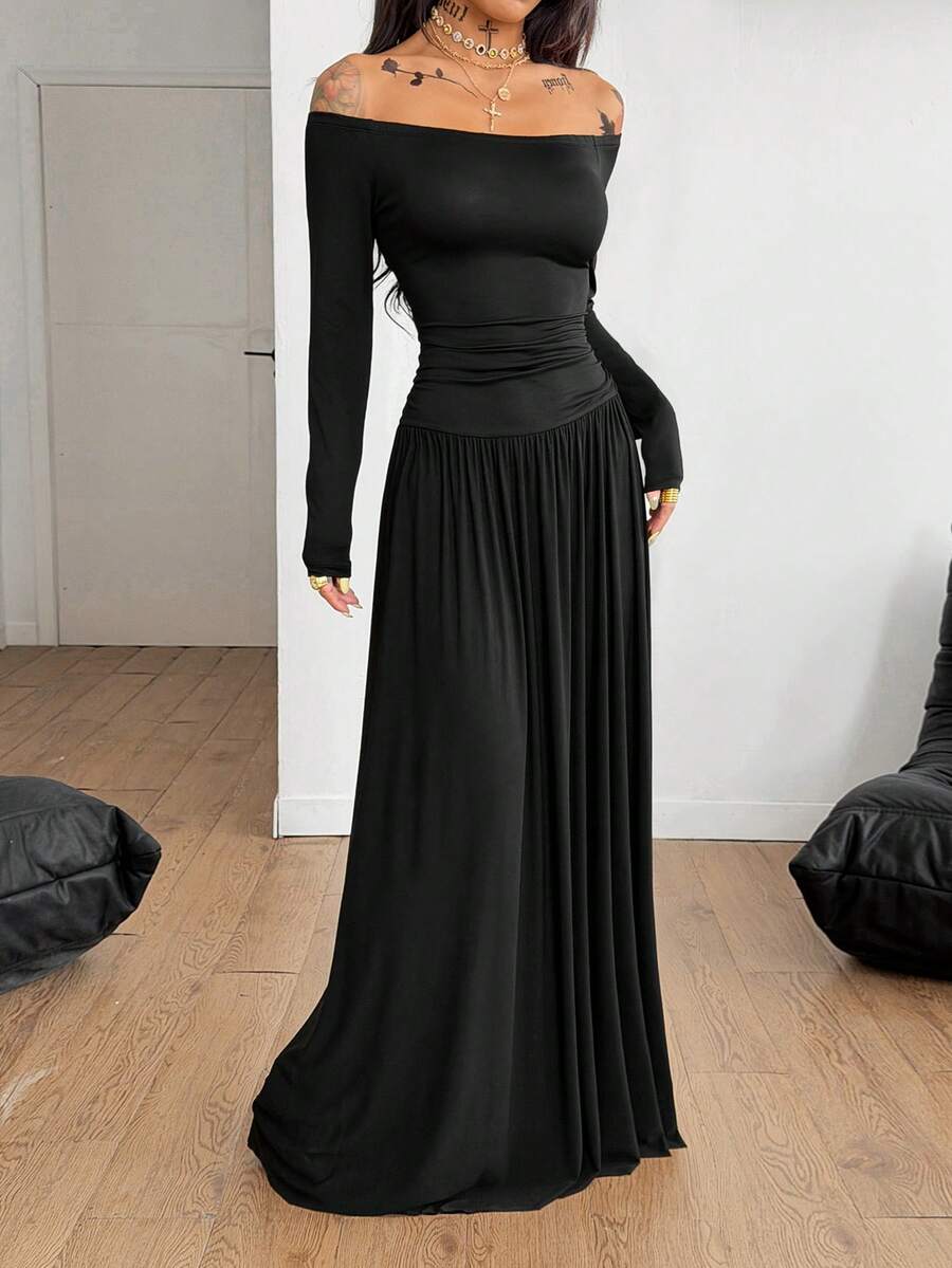 Women wearing a brown off the shoulder maxi dress with asymmetrical ruched cut out details and wrist-length sleeves in a slim fit flared A-line design.