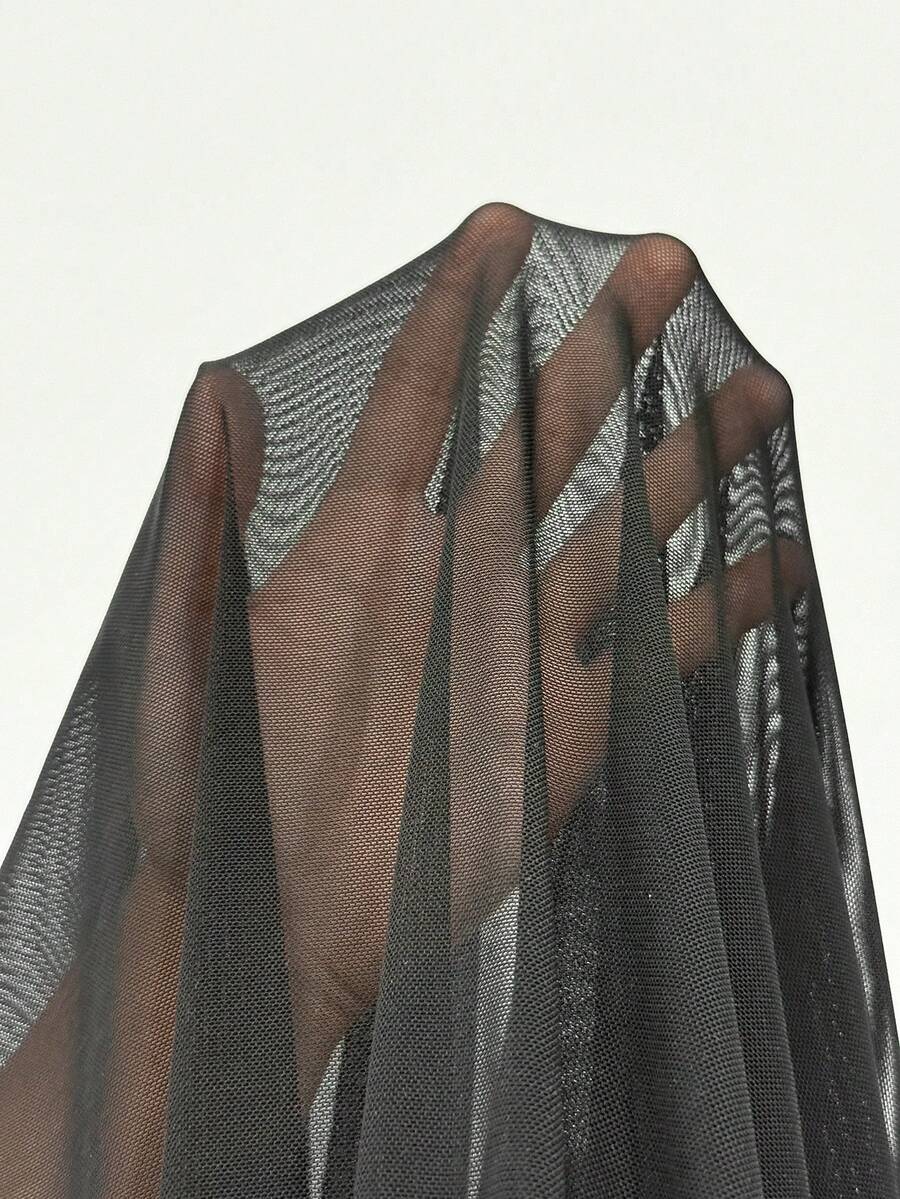 Women wearing a brown off the shoulder maxi dress with asymmetrical ruched cut out details and wrist-length sleeves in a slim fit flared A-line design.