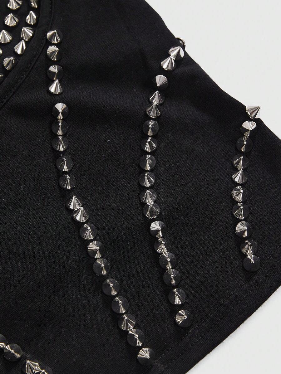 Front view of a black women's dark grunge camisole top featuring rivet studs, rhinestones, sequin details, spaghetti straps, and a slim fit.