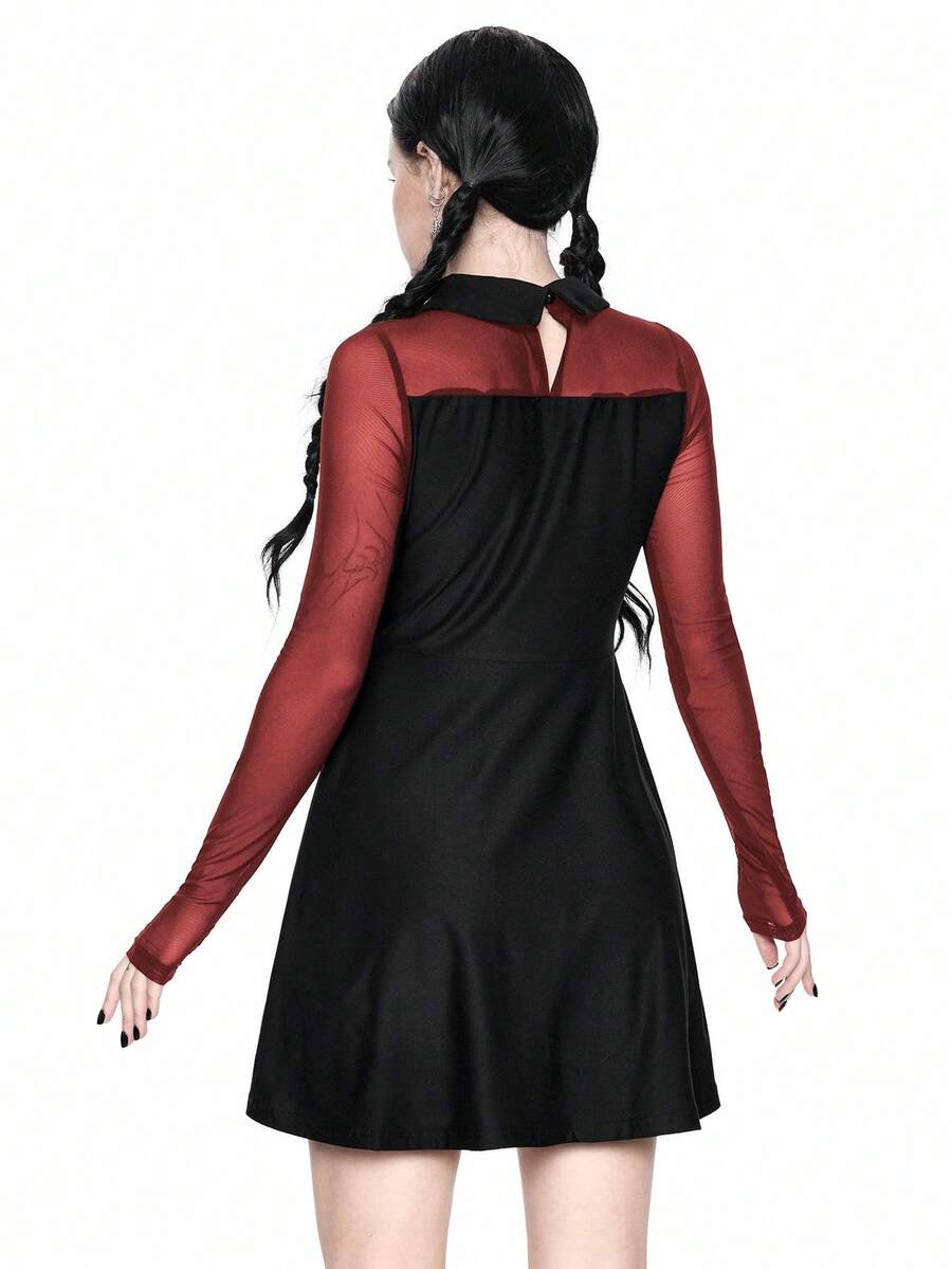 Women wearing a black gothic Halloween cat graphic print mini dress with a collar, extra-long sleeves, and a high waist fit and flare silhouette.