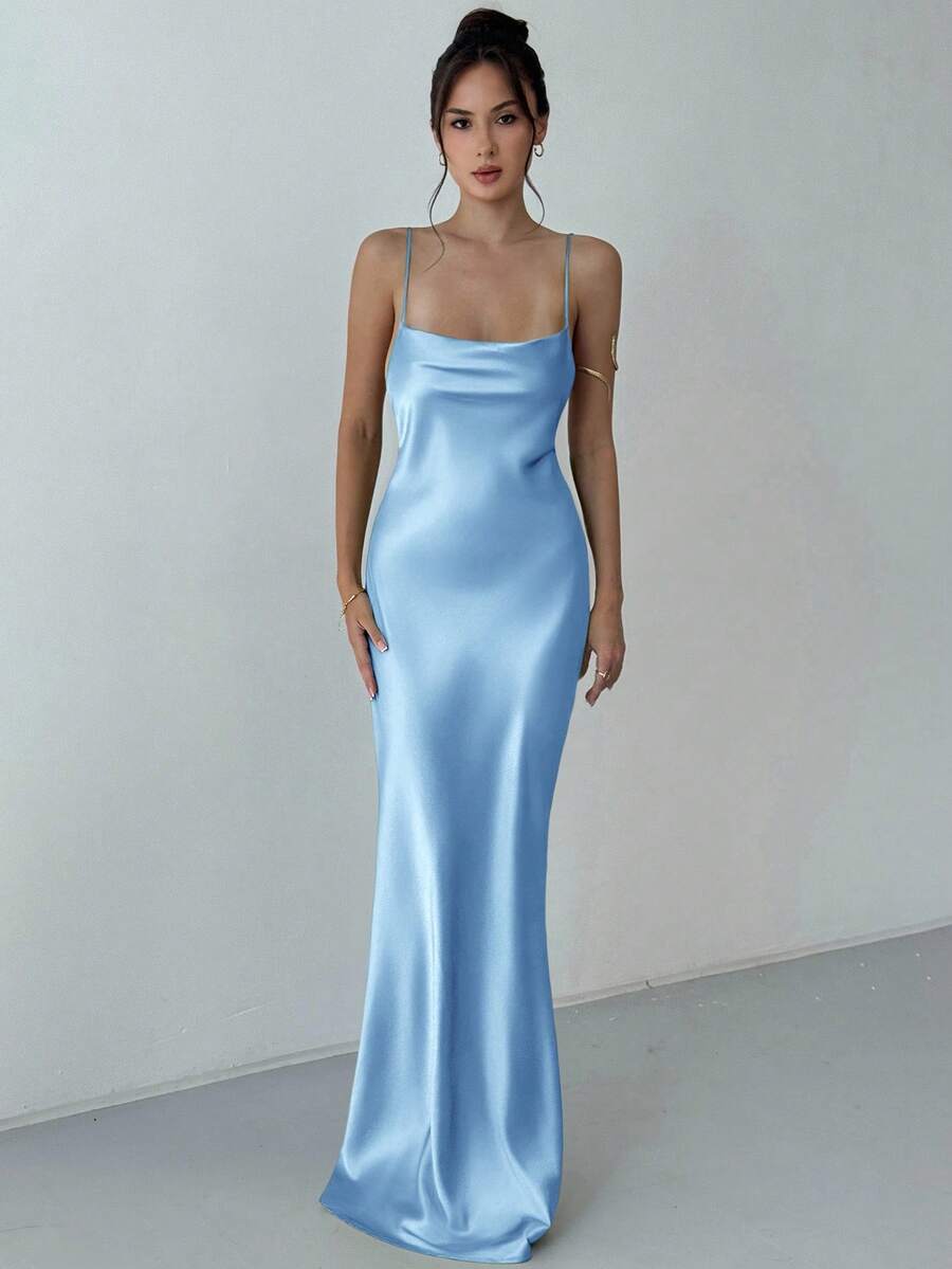Beige satin backless maxi dress featuring criss-cross spaghetti straps and a mermaid hemline.