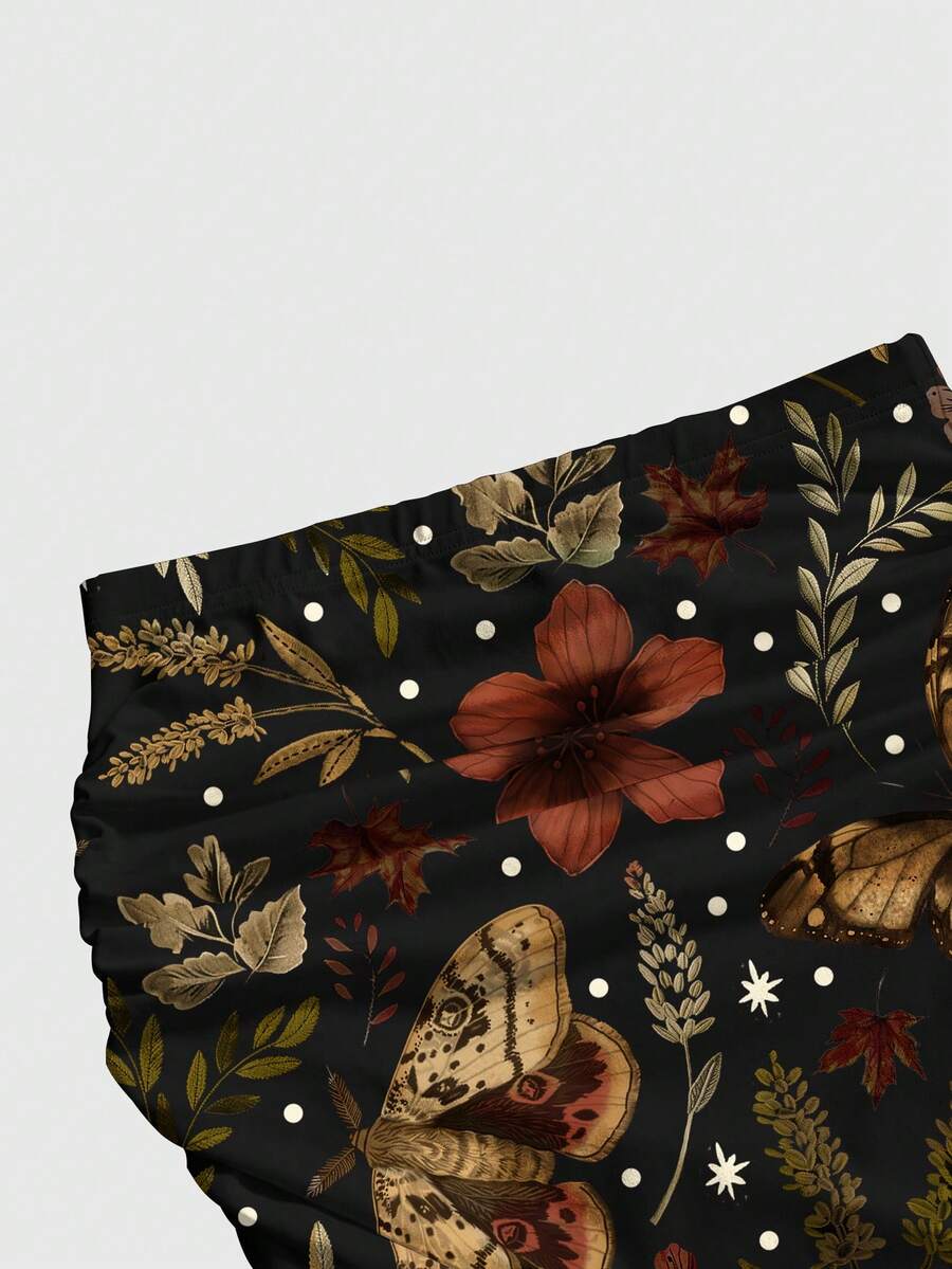 Black low waist ruched bodycon maxi skirt with sun and moon full print pattern on high stretch knitted fabric.