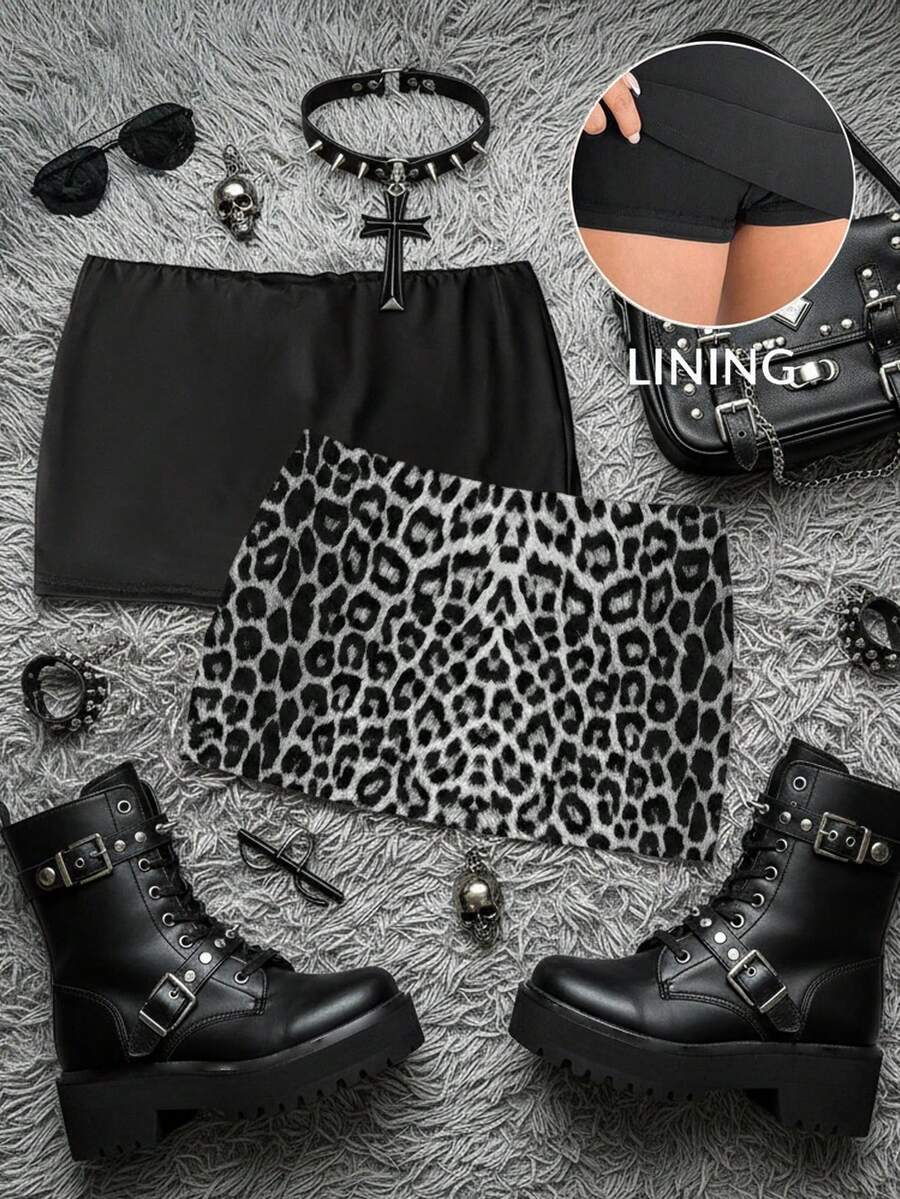 Women's black casual low rise bodycon mini skort with built-in shorts in knitted plain stretch fabric.