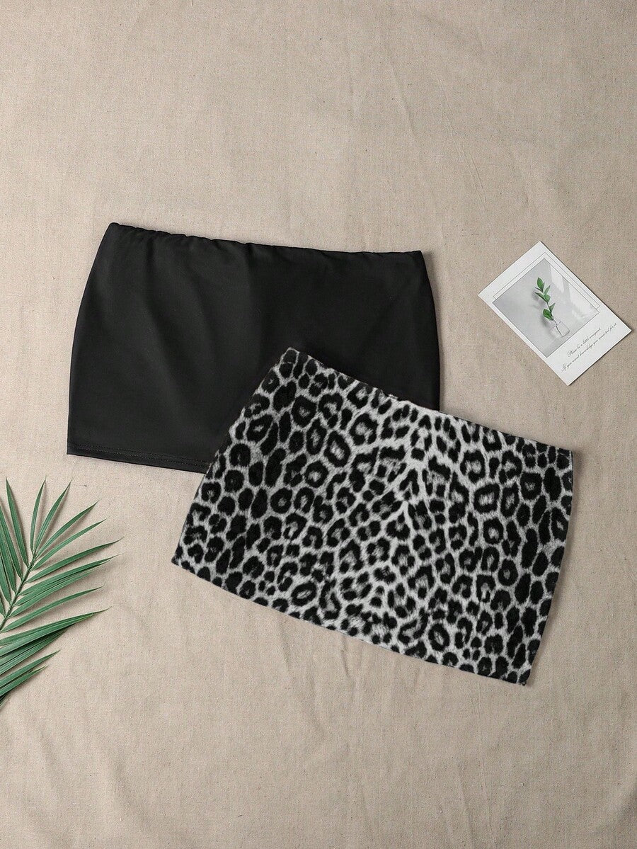 Women's black casual low rise bodycon mini skort with built-in shorts in knitted plain stretch fabric.