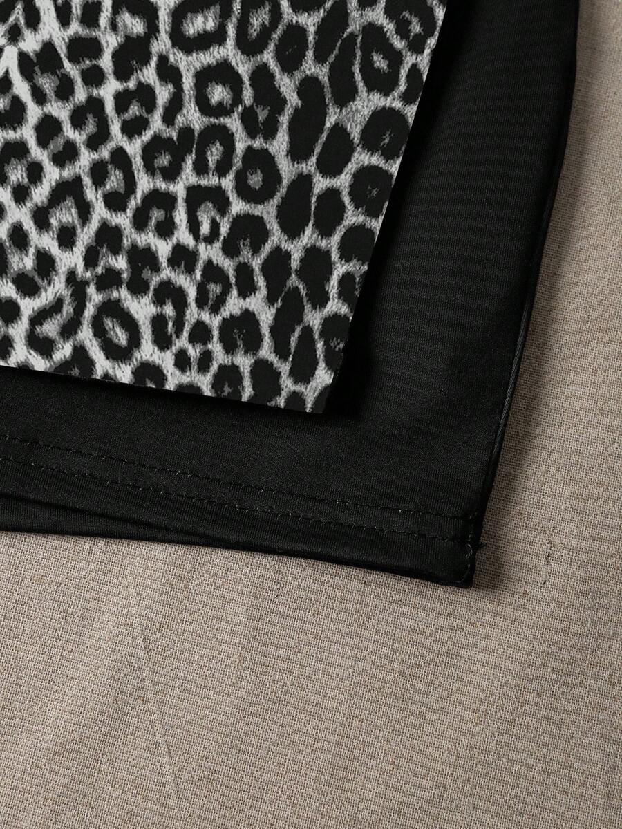 Women's black casual low rise bodycon mini skort with built-in shorts in knitted plain stretch fabric.