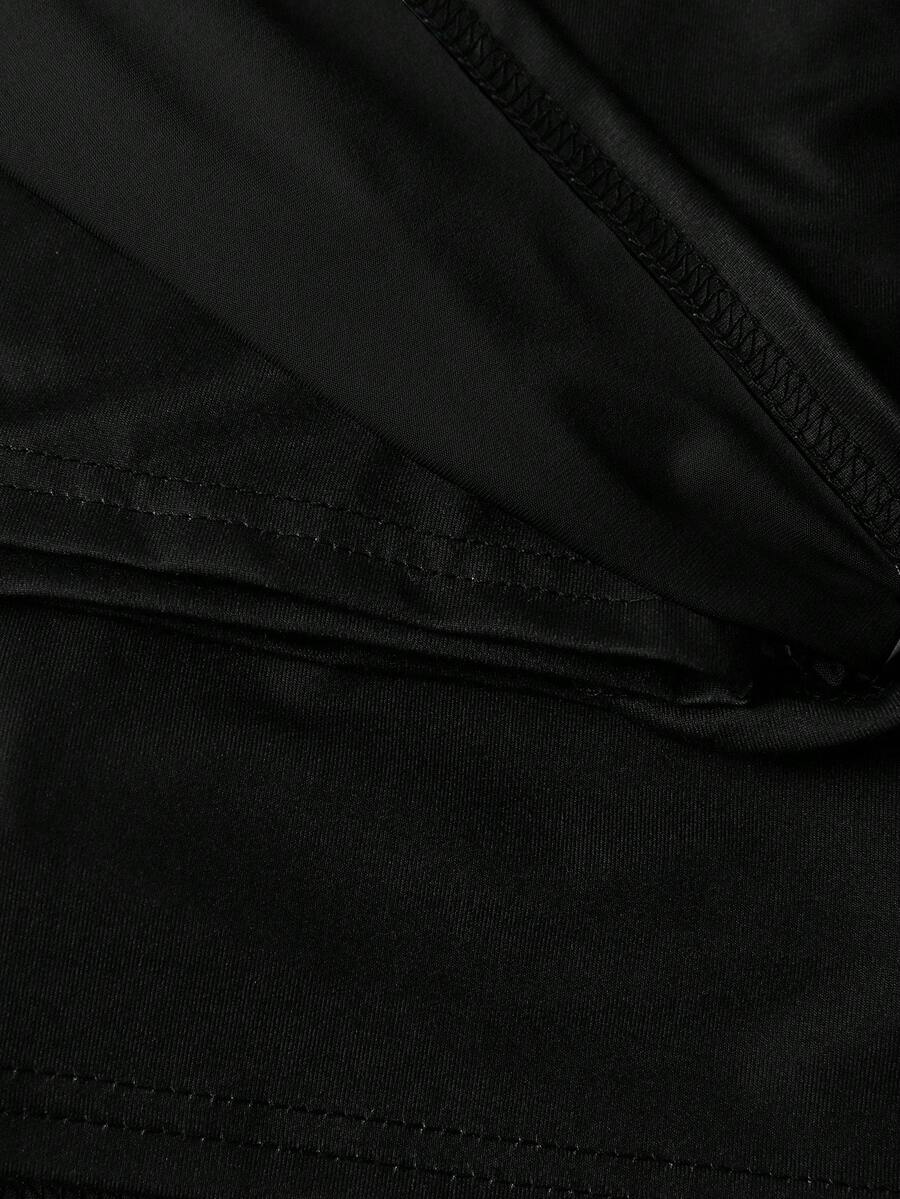Women's black casual low rise bodycon mini skort with built-in shorts in knitted plain stretch fabric.
