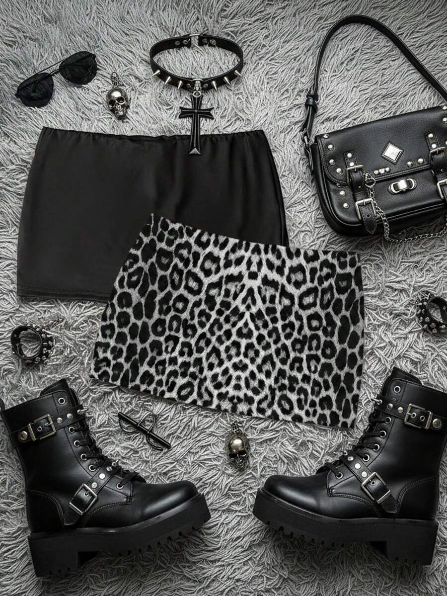 Women's black casual low rise bodycon mini skort with built-in shorts in knitted plain stretch fabric.