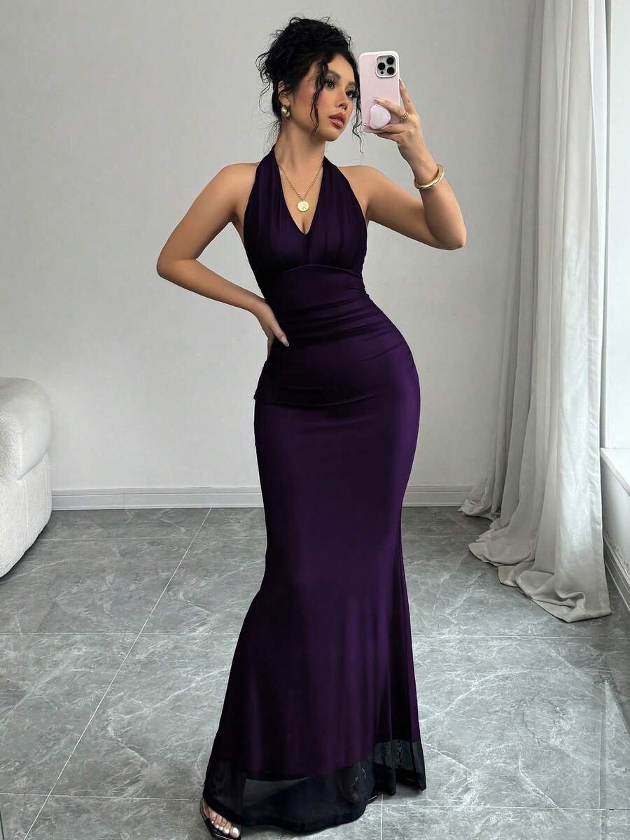Women's long sleeve mermaid bodycon dress in high-stretch mesh fabric featuring a halter backless neckline, ruched high waist, and slim fit silhouette for formal evening wear.