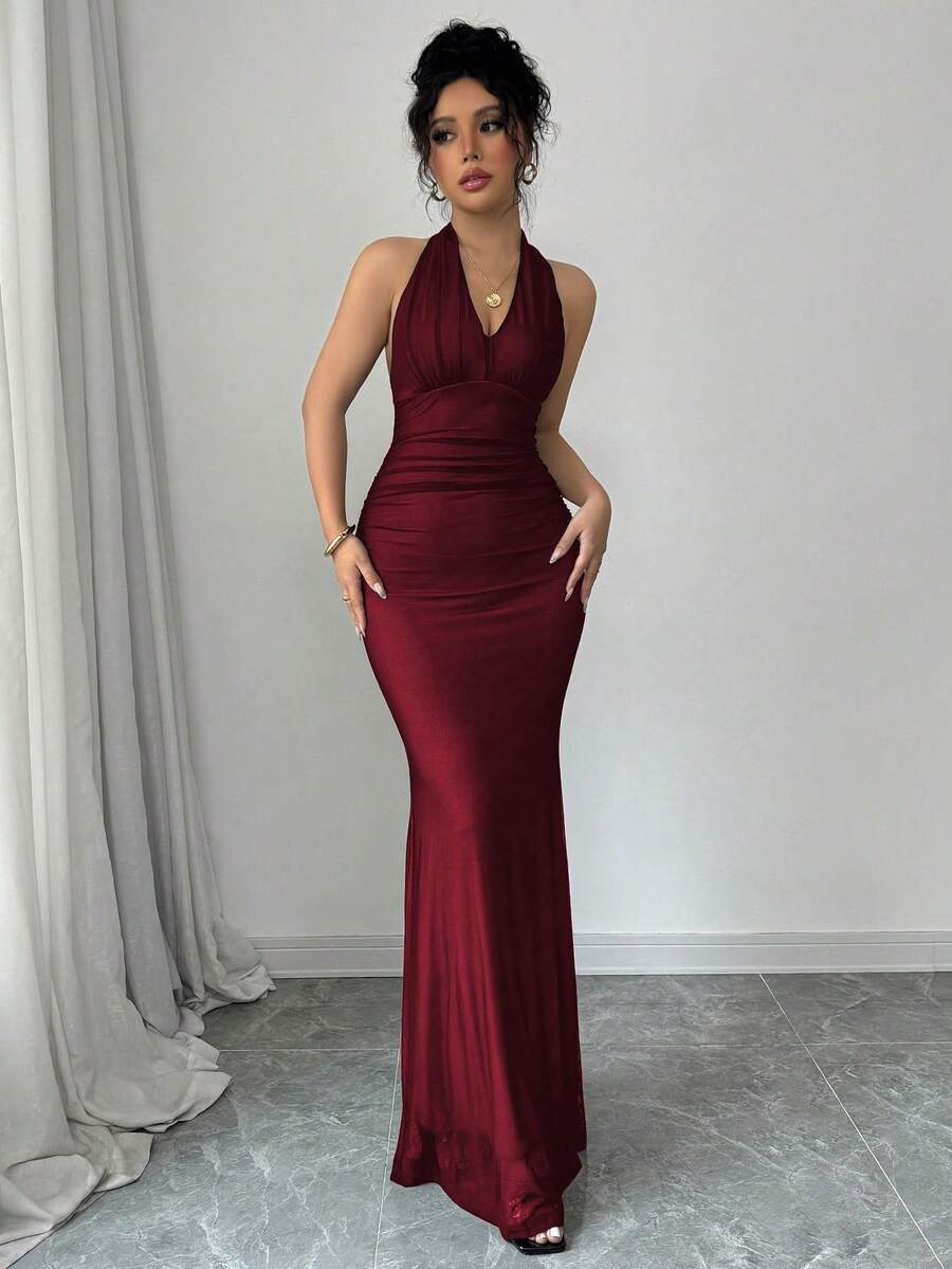 Women's long sleeve mermaid bodycon dress in high-stretch mesh fabric featuring a halter backless neckline, ruched high waist, and slim fit silhouette for formal evening wear.