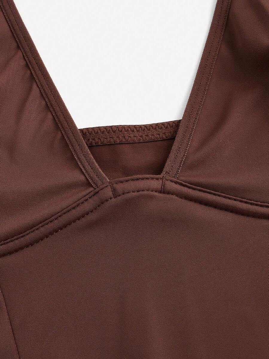 Apricot backless shapewear bodysuit with thong cut, cup details, and high-stretch fabric for light tummy support.