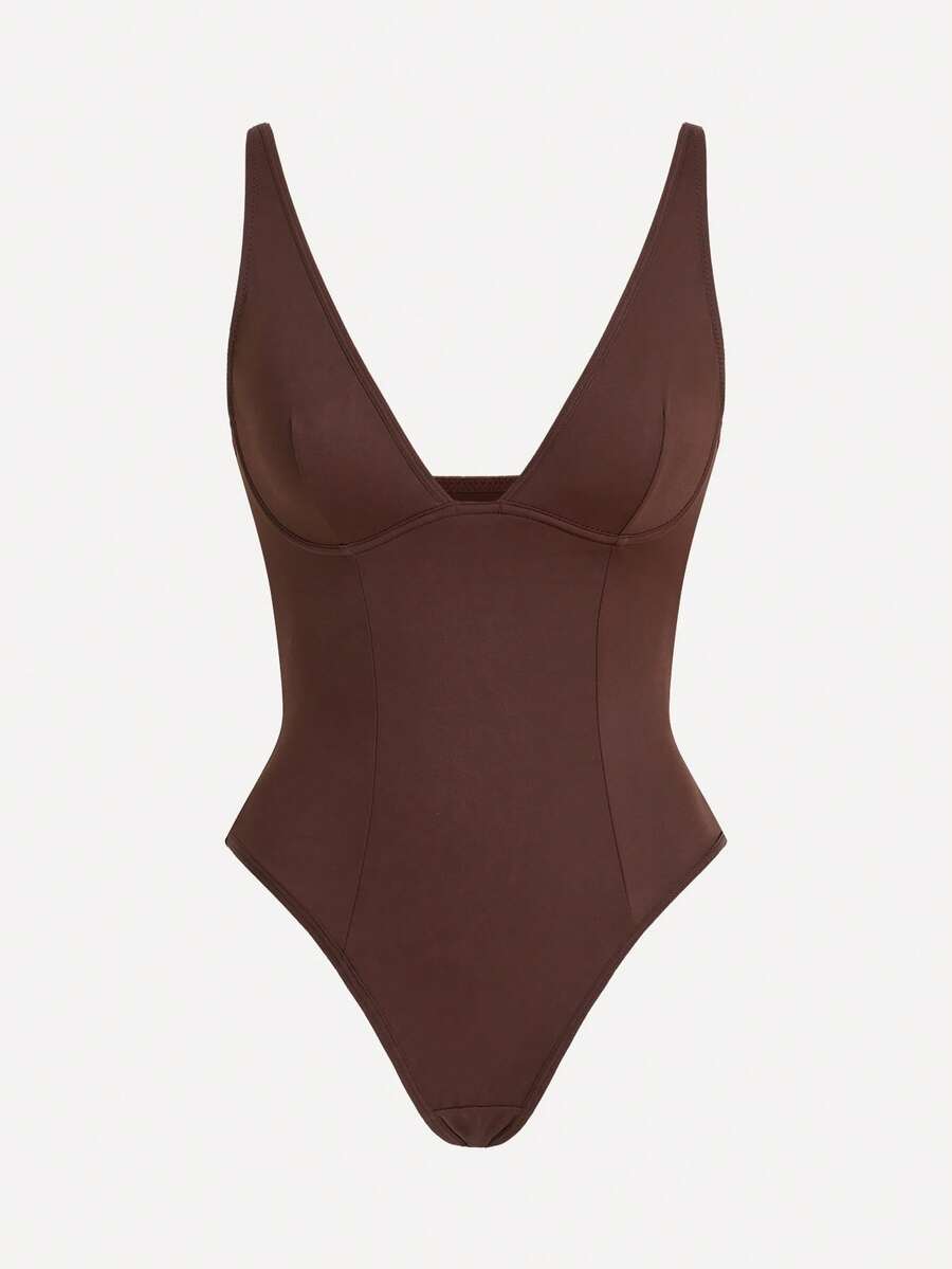 Apricot backless shapewear bodysuit with thong cut, cup details, and high-stretch fabric for light tummy support.