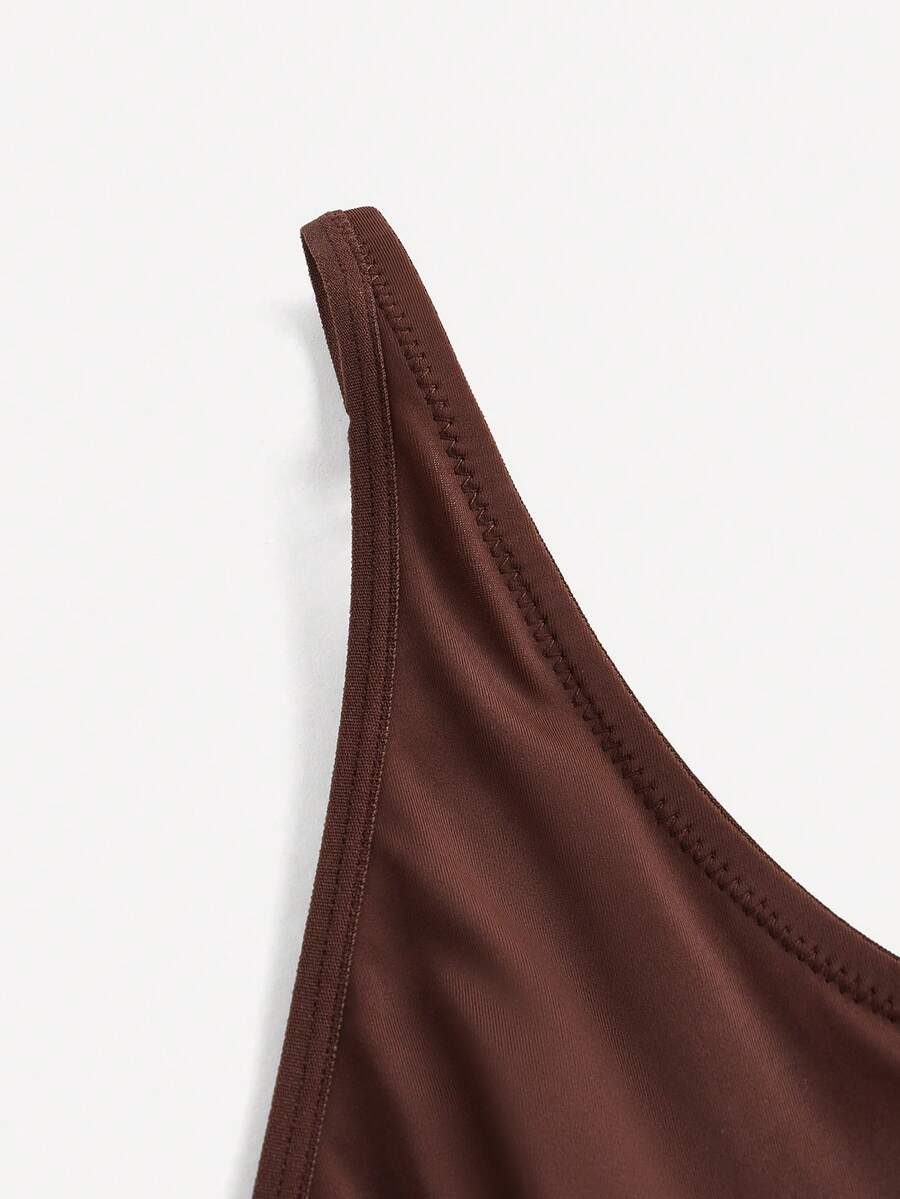 Apricot backless shapewear bodysuit with thong cut, cup details, and high-stretch fabric for light tummy support.