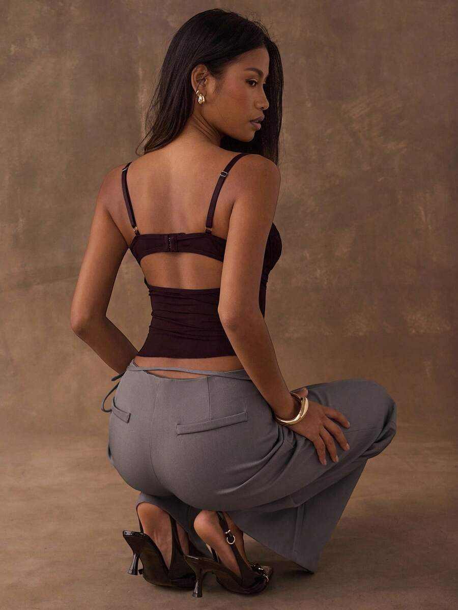 Women's black contrast lace camisole with spaghetti straps, cup detail, semi-sheer finish, and slim fit for going out or date night.