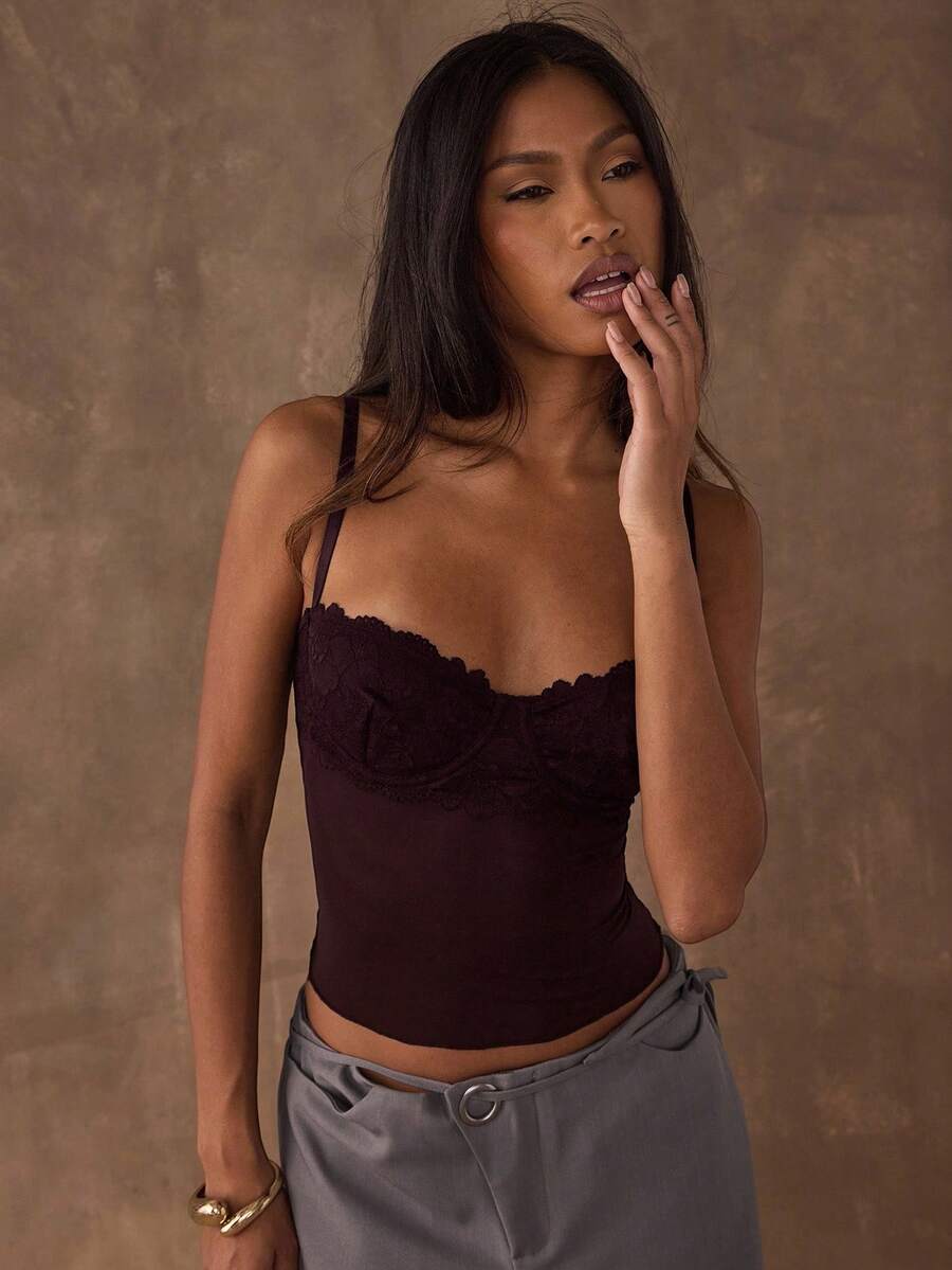 Women's black contrast lace camisole with spaghetti straps, cup detail, semi-sheer finish, and slim fit for going out or date night.